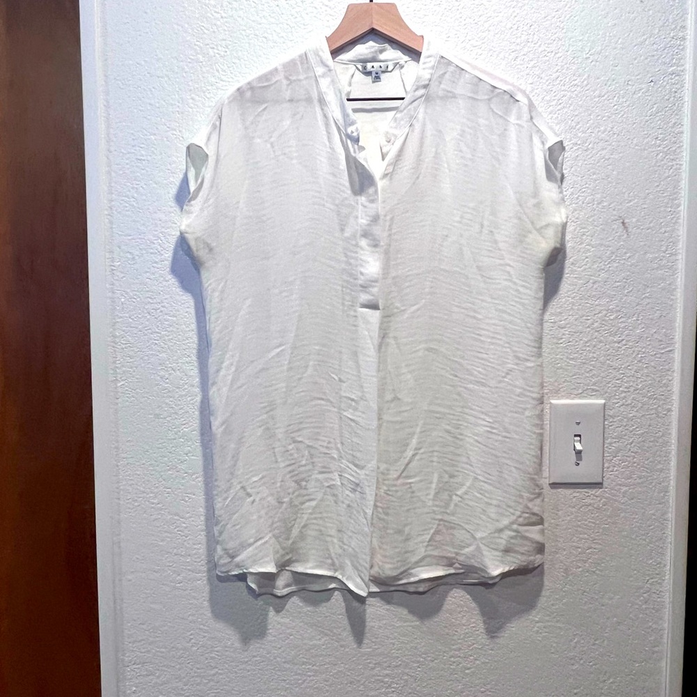 Loose fitting white blousy top